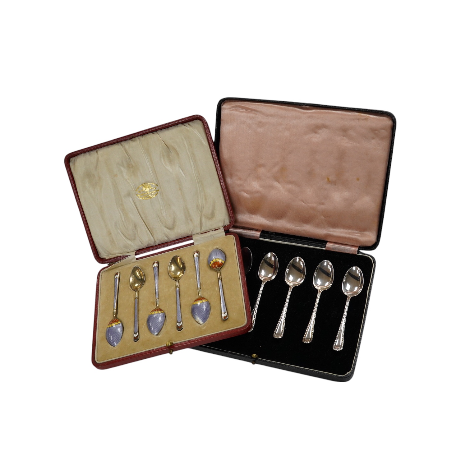 Two cased sets of six silver teaspoons, including enamelled. Condition - poor and good